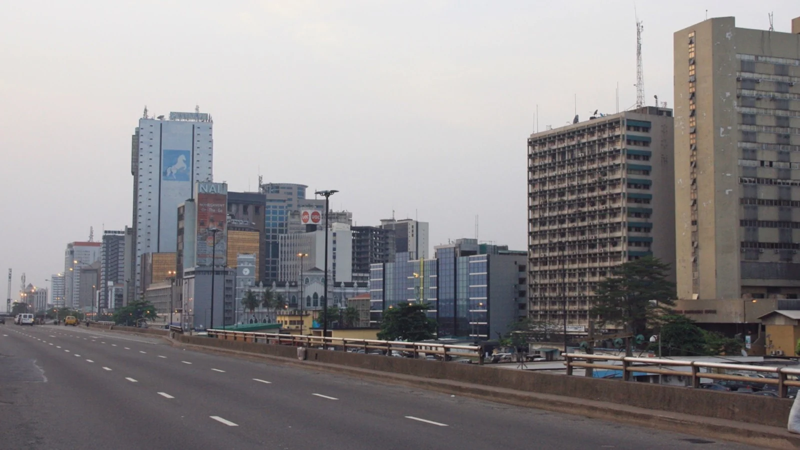 Lagos skyline and the NGX trading floor at dusk